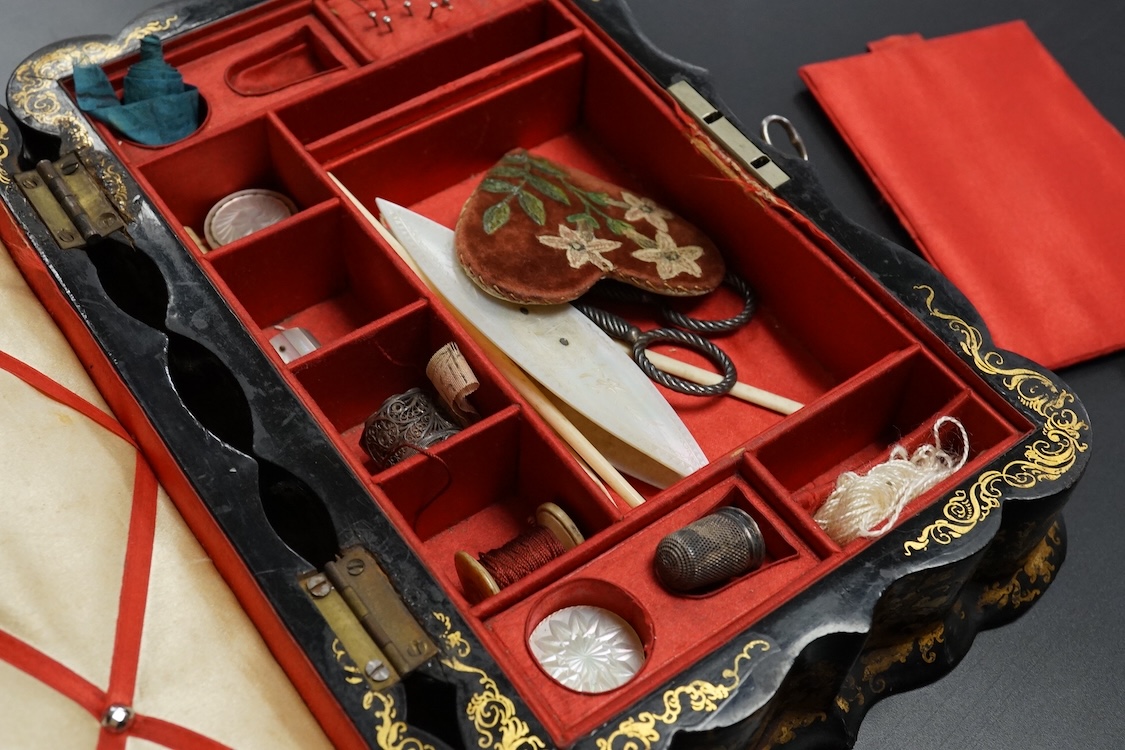 A Victorian Papier mache japanned sewing box, stamped ‘Lane, Birmingham’, the cover with a view of Chingford old church Essex, a boxed Victorian French translation game, by E C Spurin and a papier mache panel (3)